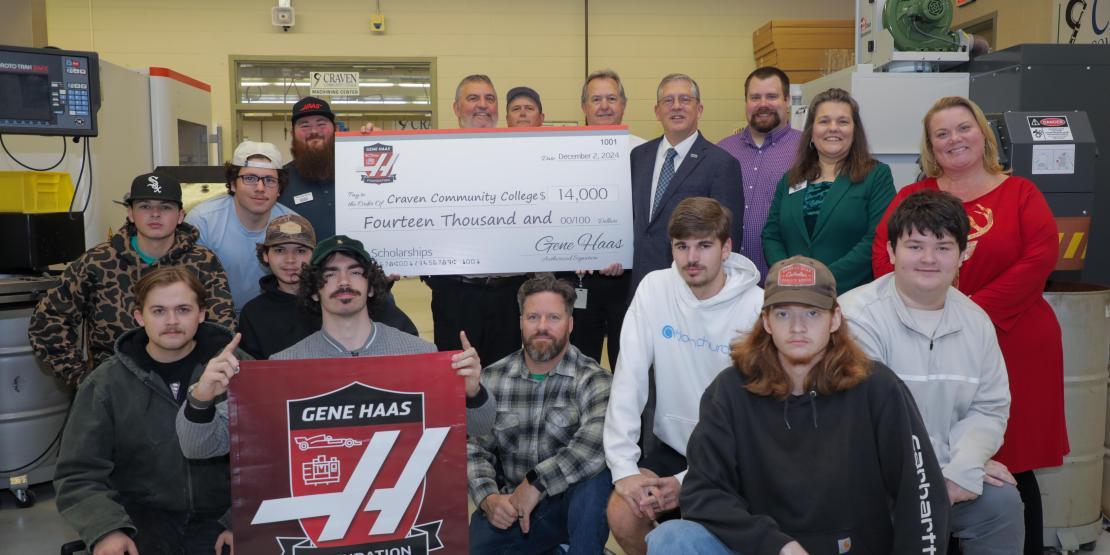 Students holding check 