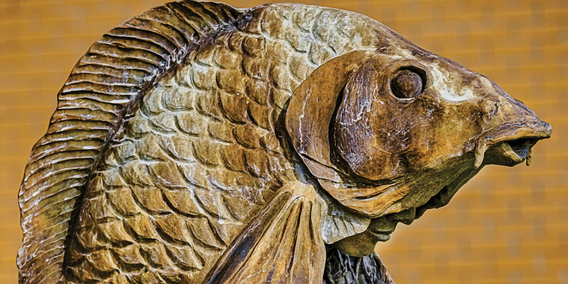 Bronze sculpture of fish-man hybrid