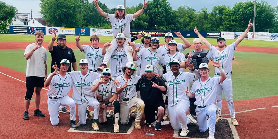 Panthers baseball players in a group with trophy