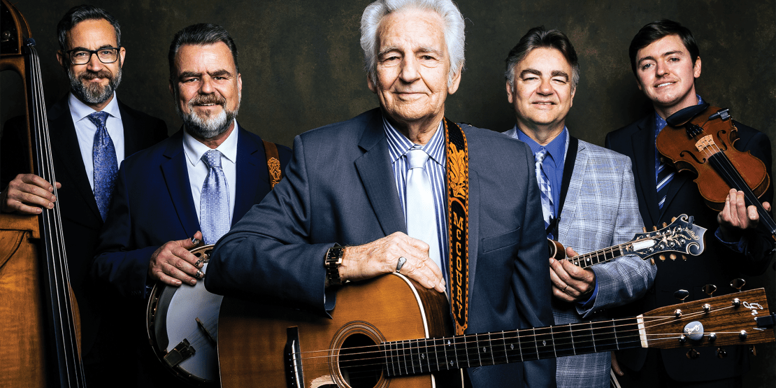 Five male members of the Del McCoury Band posed with instruments