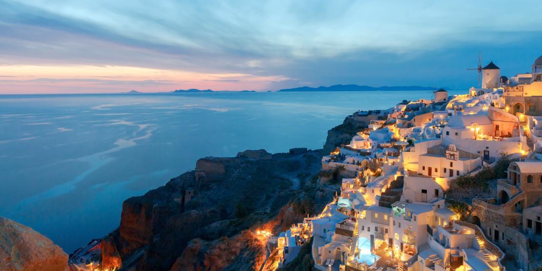 Sunrise over the sea and aerial view of Santorini