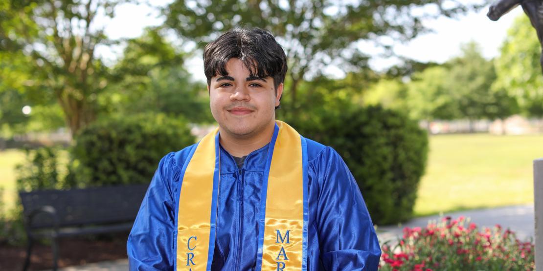 Person standing in graduation robe