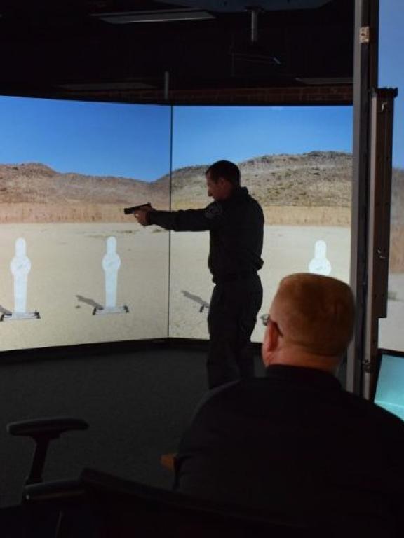Craven CC has collaborated with the City of New Bern to provide local law enforcement agencies with a new Law Enforcement Simulator Training program, which will utilize a state-of-the-art training simulator. Pictured is Sgt. Billy Zerby of the New Bern Police Department demonstrating a training scenario.