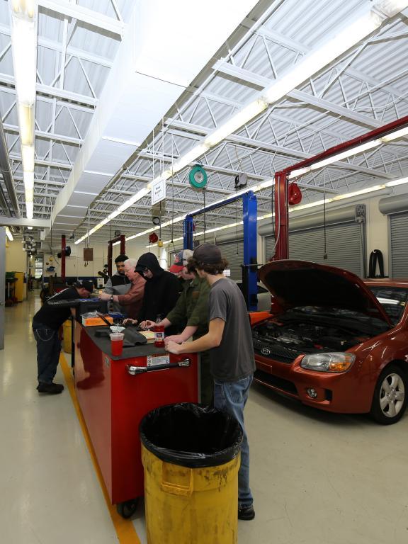 automotive students work on cars