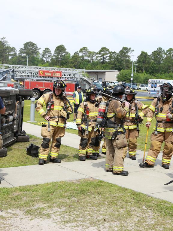 Group of firefighters stand around during casualty drill