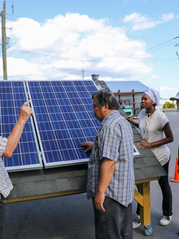 Instructor teaches students about solar photovoltaic technology