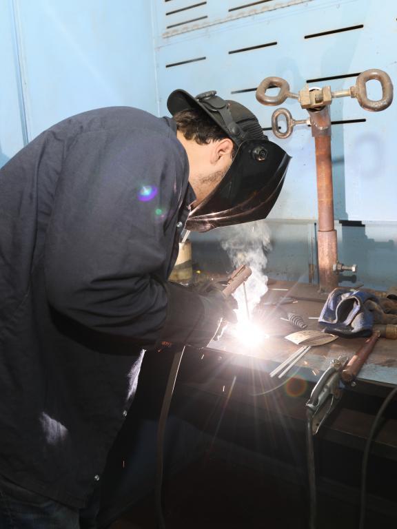 Student practices welding techniques