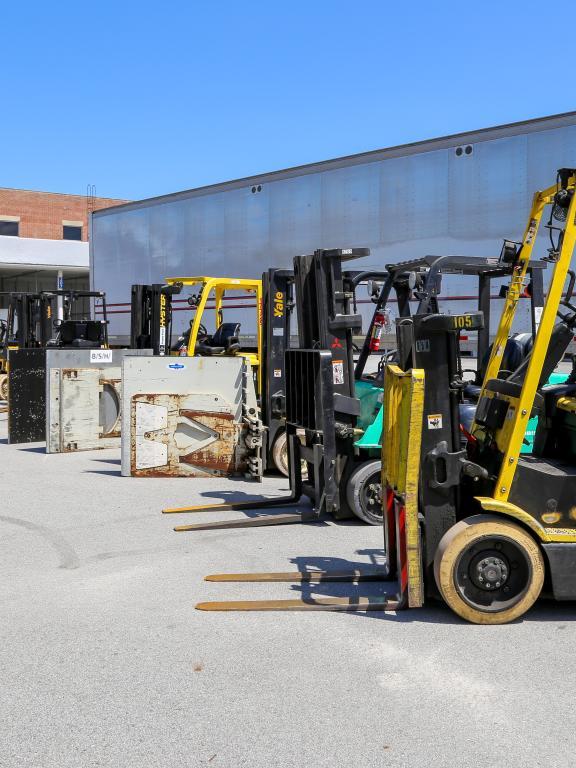 Row of forklifts outside