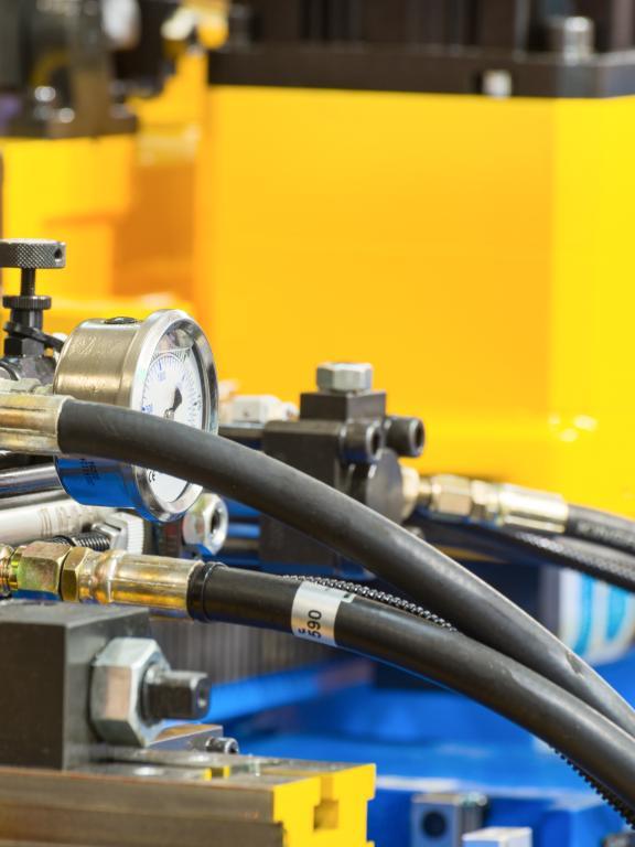 Yellow Industrial Machine with Black Airhoses 
