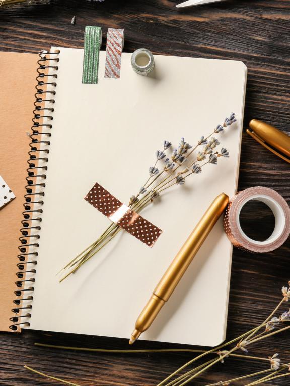 Journal with craft accessories and flowers