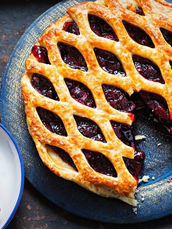Fruit pie with lattice style crust on a plate