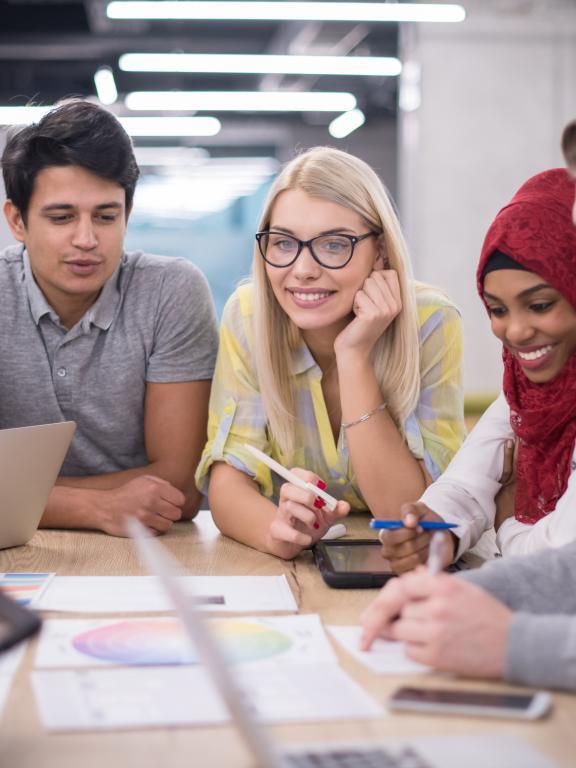 Multiethnic group of young-to-middle-age adults having a business meeting
