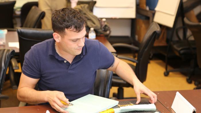 Military student works at desk