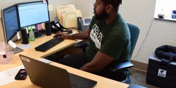 Austin Dixon, Career & College Promise (CCP) advisor at Craven CC, sets up an online conference with a student. The CCP program is now enrolling high school juniors and seniors for the opportunity to earn college credit at no cost.