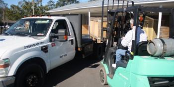 Eddie Foster, executive director of the Volt Center, uses a forklift to unload equipment that Gregory Poole donated to the college’s new Diesel Technology program. The program, which also received equipment donations from Volvo and Caterpillar, will begin Jan. 11.