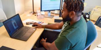 Austin Dixon, Career & College Promise (CCP) program advisor, speaks with a student during a virtual meeting. The CCP program recently received a $1,000 grant from the International Paper Foundation.