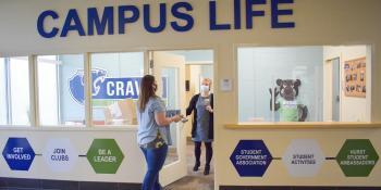 Craven CC student ambassador Leigh Anne Hollar delivers canned goods to Campus Life Coordinator Chelsea Robinson for the college’s Panther Pantry. The Campus Life department is holding a Thanksgiving Meal Drive through Friday, Nov. 20 for students and employees in need during the holidays.