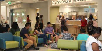 Students sign up for classes in Craven CC’s newly renovated First Stop, a streamlined student services area located in Barker Hall on the New Bern campus. Registration is open through Aug. 19 for new and returning students.