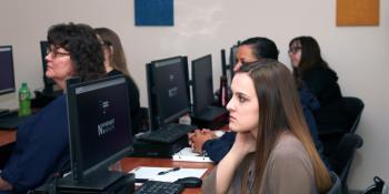 Students in Craven CC’s Health Information Technology (HIT) program look on during a class discussion. The HIT program is accepting applications through July 31.