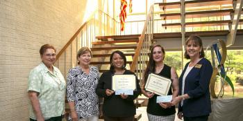 Members of the New Bern Woman’s Club and Craven CC Financial Aid Advisor II Carolyn Ward present students Latasha Seymour and Tiffany Timblin with scholarships.