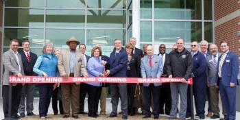 College and county/city officials line up at STEM Center ribbon cutting