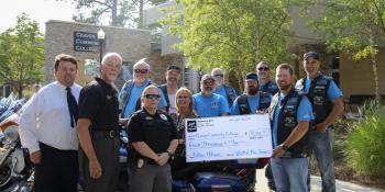 The Veteran Enforcers Motorcycle Association (VEMA) of New Bern presents a $4,000 check to the Craven CC Foundation on May 28 to benefit students in the college’s Basic Law Enforcement Training program.