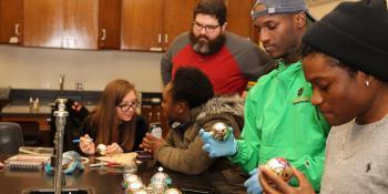 Students in the Science Club decorate ornaments