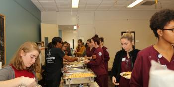 Craven Community College Students line up Wednesday for a Thanksgiving meal that included donations from several local businesses and individuals.
