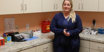 Former nursing student stands in medical office