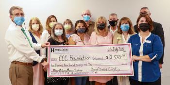 The Craven CC Foundation is presented with a scholarship donation from the Havelock Chamber of Commerce in memory of Megan McGarvey on Aug. 25. Pictured left to right, back row: Havelock Chamber Chair Kim Rice Smith, CarolinaEast Health System Manager of Public Relations and Outreach Brandy Popp, McGarvey's family members Carol Sue Lee and David Lee, Ken Dimpsey of Munden Funeral Home, and Craven CC Executive Director of Institutional Advancement Charles Wethington; front row: Craven CC President Dr. Ray St