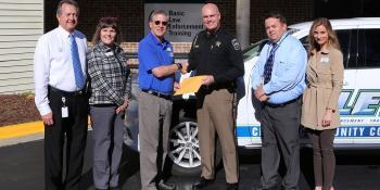 Students from the Basic Law Enforcement Training (BLET) program presented Craven County Sheriff Chip Hughes with a $400 donation to help Craven County Deputy Zachary Bellingham in his recovery. The students raised funds during "no-shave November" in honor of Bellingham, who was shot in the line of duty on Oct. 1. Pictured left to right: Dean of Career Programs Ricky Meadows, VP for Instruction Dr. Kathleen Gallman, President Dr. Ray Staats, Craven County Sheriff Chip Hughes, BLET Program Coordinator Jim War