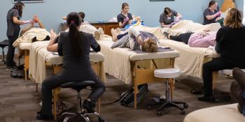 Students in the Esthetics Technology program give patients facials