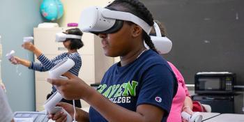 A Transitions Academy student explores space in a virtual reality headset.