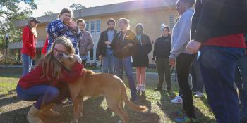 Students in Craven Community College’s Transitions Academy donate dog biscuits they made as part of a community service project. Representatives from the Craven Pamlico Animal Services Center and Craven County Sheriff’s Office Animal Protective Services brought along a furry friend, Nugget, as an official taste tester.